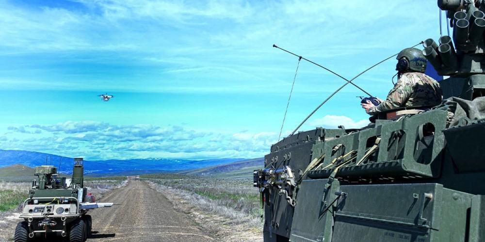 The Army tests an integrated mounted reconnaissance capability on a manned Stryker and an unmanned ground system called the Squad Maneuver Equipment Transport during the Joint Warfighter Assessment (JWA) 2019 in December. The Army is preparing Joint All-Domain Command and Control, or JADC2, capabilities to test at the next JWA in 2021. Credit: U.S. Army photo by Jack Bunja. 