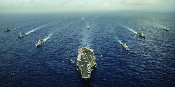 The aircraft carrier USS George Washington and ships from the U.S. Navy, the Indian navy and the Japan Maritime Self-Defense Force participate in trilateral naval field training. Carrier strike groups may be increasingly vulnerable to antiship missile systems and could be better protected with the use of an integrated electronic warfare capability.