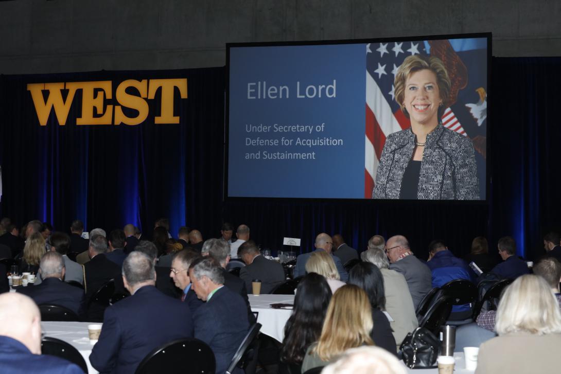 Undersecretary of Defense for Acquisition and Sustainment Ellen M. Lord addresses WEST attendees via video link. Photo by Michael Carpenter