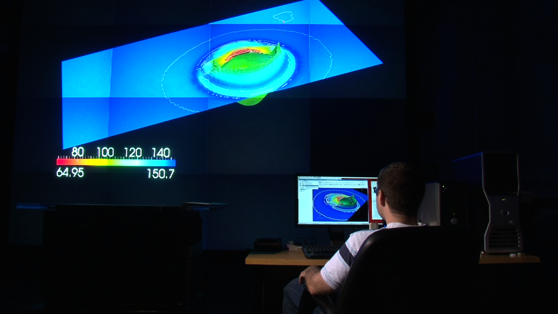 A researcher uses the Army Research Laboratory Supercomputing Research Center's modeling and simulation applications to visualize complex ballistics interactions using data calculated on the Center's supercomputers.  The ARL center is home to two of the world's 100 fastest computers.