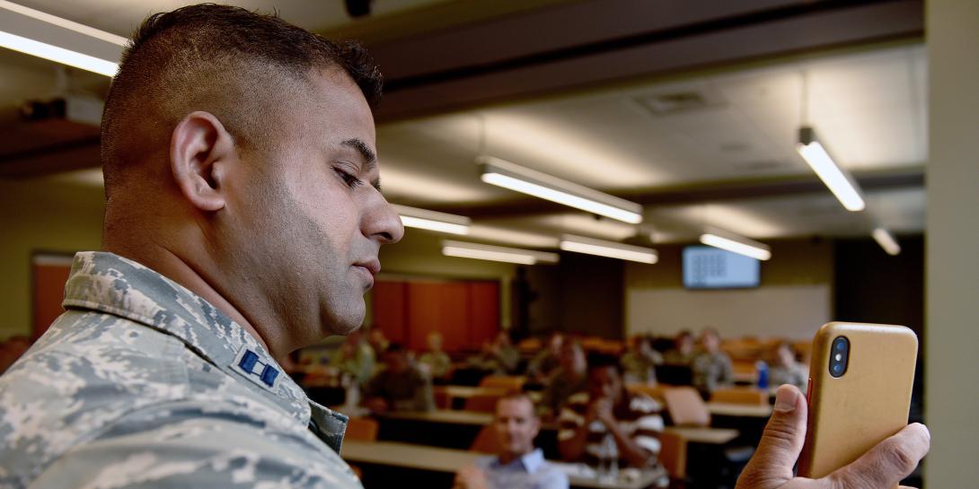 Capt. Liaquat Ali, USAF, deputy director of AF Connect, speaks to airmen about the Air Force Connect mobile app at the Air National Guard training and education center. Capt. Ali's team at the Pentagon rolled out the innovation, which allows both public and restricted-access communications on personal mobile devices. Photo by Master Sgt. Mike R. Smith, ANG