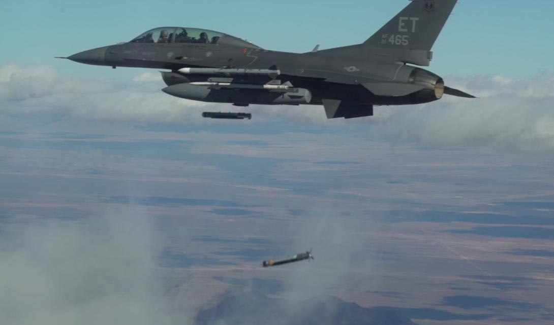 Collaborative Small Diameter Bombs (CSDBs) are launched from the wing of an F-16 fighter. Four of the bombs were dropped during the second flight demonstration of the Air Force Golden Horde Vanguard.  Courtesy photo U.S. Air Force