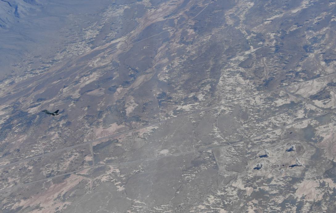 A 40th Flight Test Squadron F-16D Fighting Falcon circles the target after successfully dropping four bombs for the second Golden Horde test mission near Holloman Air Force Base.  U.S. Air Force photo by Capt. Nic Arosemena, USAF