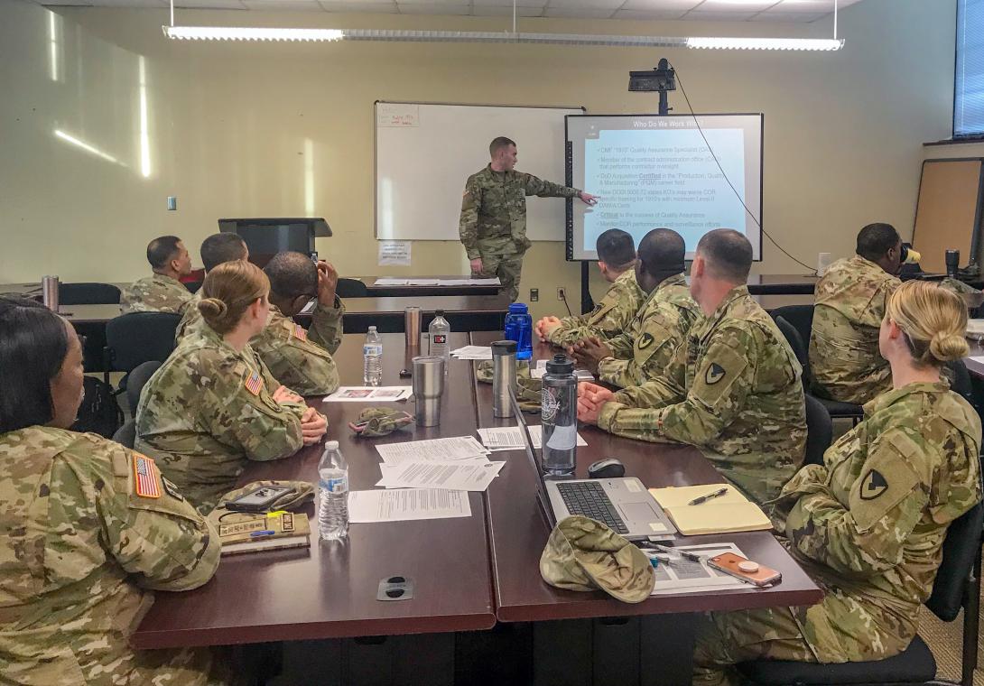 Capt. David Ray, USA, leads a quality assurance class for soldiers during a contingency contract administration services training event. Credit: Photo by Sgt. 1st Class Terry Ann Lewis