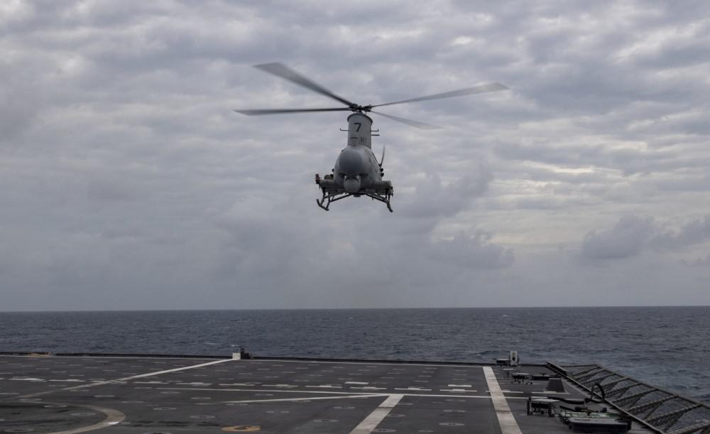 An MQ-8B Navy Fire Scout hovers over the flight deck of the Independence-variant littoral combat ship USS Montgomery in the South China Sea in January 2020. The Navy is exploring how to apply the Future Airborne Capability Environment, or FACE, open architecture to unmanned platforms such as the Fire Scout.  U.S. Navy photo by Mass Communication Specialist 2nd Class Chris Roys