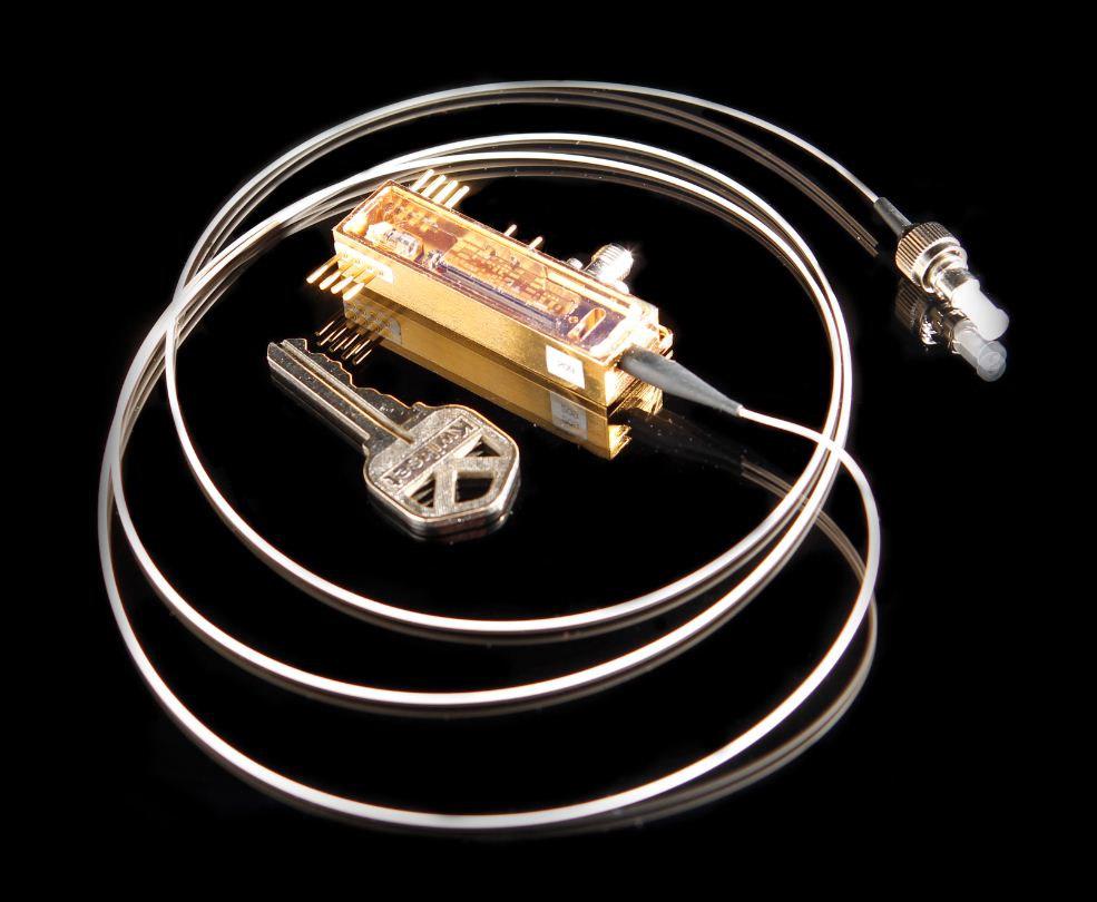 The QKarD, a miniature transmitter that communicates with a trusted authority to generate random cryptographic keys, encodes security keys on a photon using quantum mechanical principles. Photo Credit: Los Alamos National Laboratory