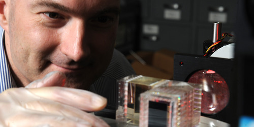 NRL's Christoph Englert examines the prototype Michelson interferometer (MIGHTI) being developed at NRL for flight on NASA's ICON mission. 