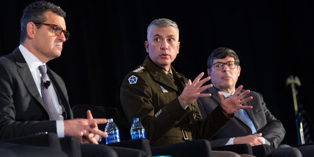 Gen. Paul Nakasone, USA (c), commander, U.S. Cyber Command, speaks on a panel at the Intelligence and National Security Summit. Photo by Herman Farrer