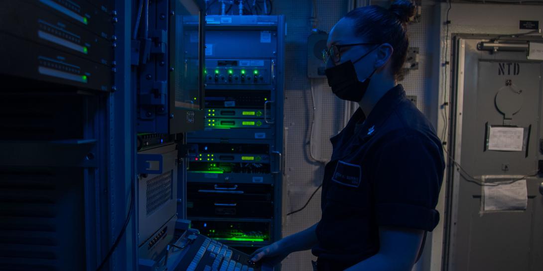 An information systems technician troubleshoots the automated digital network system aboard the USS Theodore Roosevelt. Greater network integration is vital to prevent an adversary from pre-empting a kinetic operation by purely a cyber attack. Credit: MC2 Mar'Queon Tramble, USN