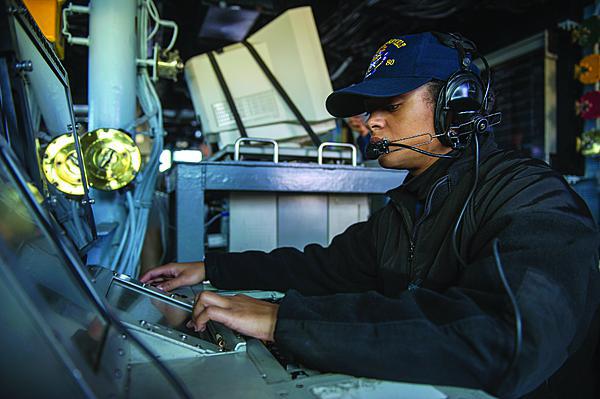 A  U.S. Navy sailor monitors communications aboard an Arleigh Burke-class destroyer. The Defense Department’s JIE builds on communications and networking advances within the individual services.
