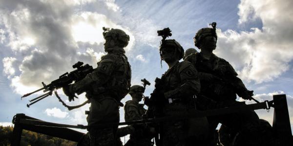 U.S. soldiers prepare for a convoy to a tactical operation center during a multinational exercise. Such exercises help the Army improve interoperability and other technology-related issues.  Spc. Randy Wren, USA
