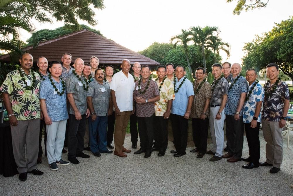 Air chiefs from countries across the Indo-Pacific region join Commander of Pacific Air Forces (PACAF) Gen. Charles Brown, USAF, (c, in white shirt) at Joint Base Pearl Harbor-Hickam, Hawaii, in December for the 2019 Pacific Air Chiefs Symposium hosted by PACAF Headquarters. During his role as PACAF commander, the general made building relationships with allies and international partners across the region a priority, as a deterrence against adversaries. Credit: U.S. Air Force photo by Staff Sgt. Hailey Haux