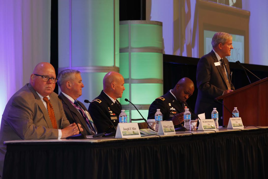 A panel discusses military communications at MILCOM 2016. Photo by Mike Carpenter