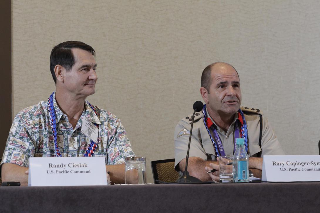 Randy Cieslak, chief information officer for the U.S. Pacific Command (l) and Brig. Rory Copinger-Symes, United Kingdom Royal Marines, deputy director for security cooperation, PACOM, speak on a panel at TechNet Asia-Pacific. Photo by Bob Goodwin