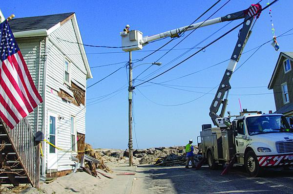 Crews work in New Jersey to restore power that was knocked out during Hurricane Sandy. GridCloud, a project between Cornell University and Washington State University, employs cloud technology to make smart grids self-healing and more resilient in the event of natural or man-made disasters. Photo Credit: FEMA/Liz Roll