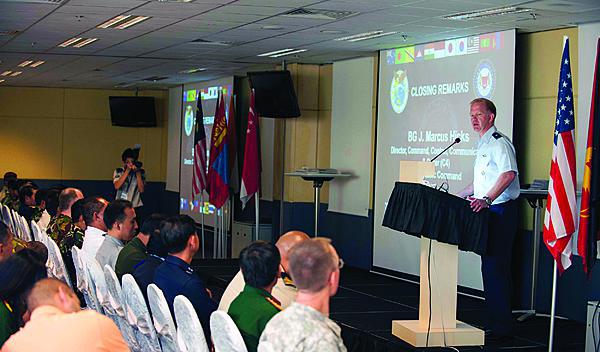 Brig. Gen. Mark Hicks, USAF, director of the J-6 at U.S. Pacific Command (PACOM), delivers remarks regarding the efforts of Pacific Endeavor 2012 at the end of the multinational exercise in Singapore.