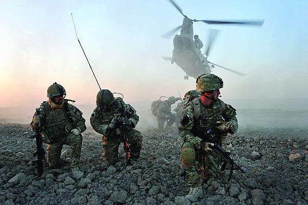 A U.S. Army soldier tests radio communications during an air assault operation in Bak, Afghanistan. The establishment of Sector ISAF changes how C5ISR is managed and provides a blueprint for future operations. 