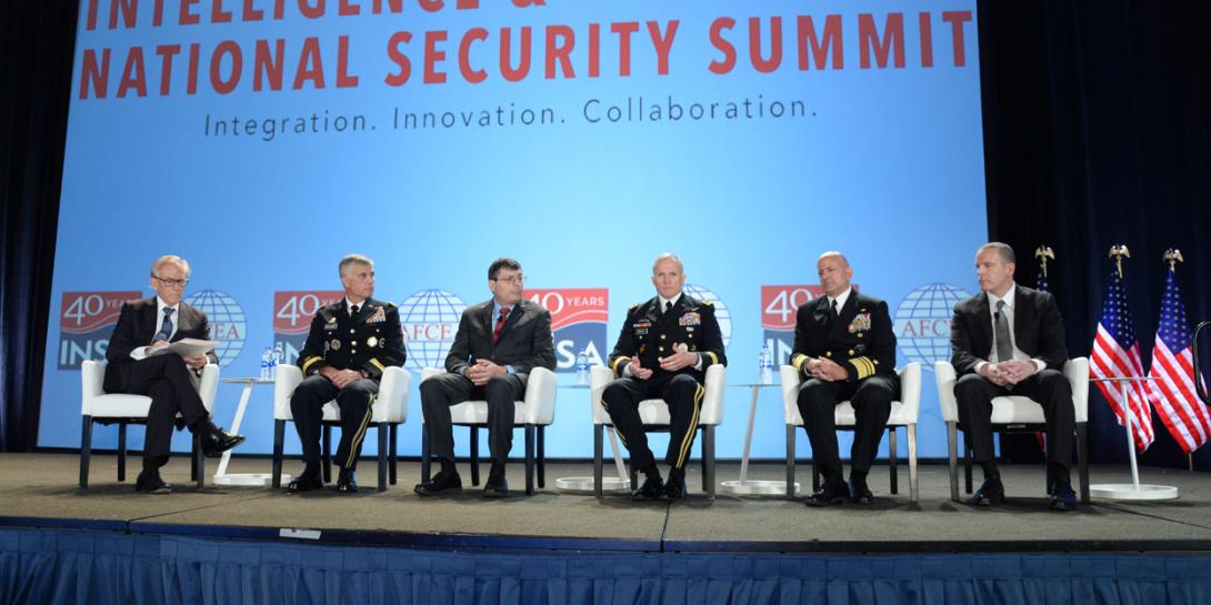 A phalanx of U.S. intelligence chiefs review the community's progress to close out the Intelligence & National Security Summit. Pictured are (l-r) panel moderator David Ignatius, associate editor and columnist, The Washington Post; Lt. Gen. Paul M. Nakasone, USA, commander, CYBERCOM and NSA; Christopher Scolese, director, NRO; Lt. Gen. Robert P. Ashley, USA, director, DIA; Vice Adm. Robert Sharp, USN, director, NGA; and Paul Abbate, associate deputy director, FBI. Credit: Herman Farrer Photography