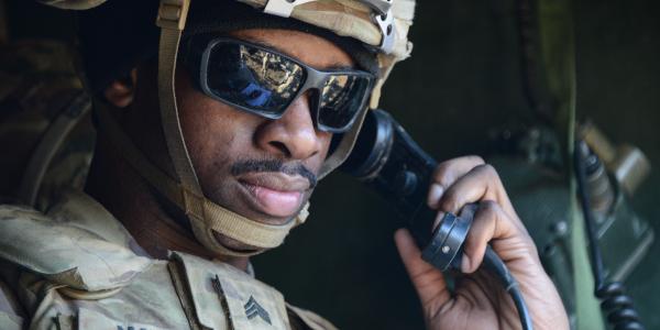 A U.S. Army sergeant communicates via radio on maneuvers in Germany. Army researchers are looking to incorporate new technologies into the service’s communications network to be able to maintain information supremacy in future combat operations. U.S. Army photo