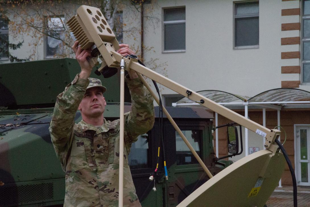 A U.S. Army Reserve information technology specialist installs a satellite receiver in an exercise in Kaiserslautern, Germany. Urban areas, which may be battlegrounds in future conflicts, often are rife with various municipal and industrial sensors that could provide vital data to Army networks under the ARL’s Internet of Battlefield Things (IoBT) research work.