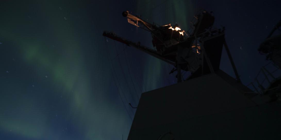 An aurora borealis appears in the night sky over the USS Thomas Hudner during an exercise in the Arctic. U.S. and allied forces are paying greater attention to operations in the Arctic and the North Atlantic in the face of an increased Russian threat. Credit: U.S. Navy photo