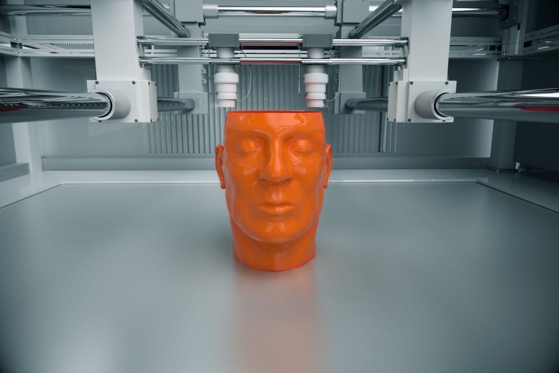 A 3D printed model of a human head takes shape on an additive manufacturing stand. The creation of custom-made human body parts may be the next big market for additive manufacturing.  Shutterstock/Dabarti CGI