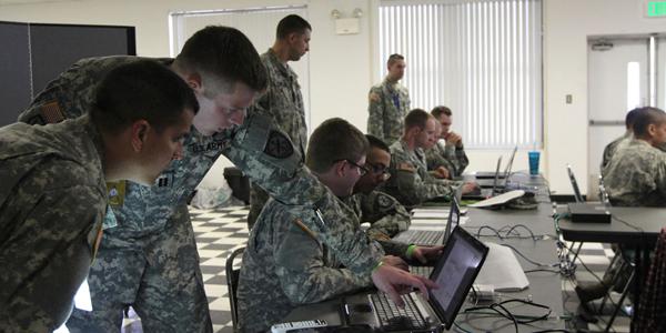 Soldiers of the U.S. Army’s 780th Military Intelligence Brigade take part in a cyber development and mentorship exercise at Fort Meade, Maryland. Army cyber is experiencing a convergence of intelligence, electronics and communications disciplines.
