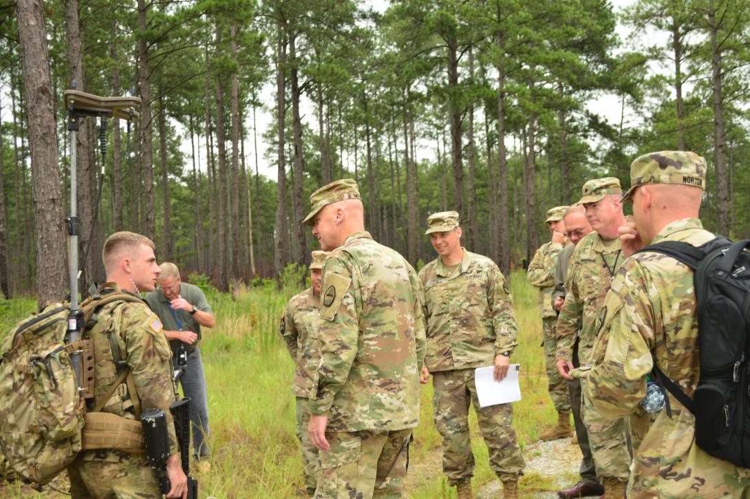 Maj. Gen. John B. Morrison Jr., USA, commander of the Army Cyber Center of Excellence, meets with soldiers in the field to hear their perspectives on equipment performance during a Cyber Quest exercise. The Army Cyber Battle Lab relies on operational feedback to validate some of its experiments.