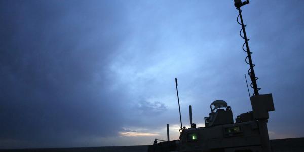 U.S. Marines in Afghanistan stand watch in a mine-resistant ambush-protected (MRAP) vehicle. The Joint Improvised-Threat Defeat Organization (JIDO) is considering factors such as security and reliability as it carefully weighs which types of data it will move to the cloud.