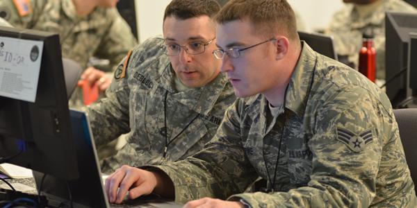 Two Vermont Army National Guard computer network defense team members participate in a 2014 Cyber Shield exercise. The command and control of defensive cyber operations now is centralized in the Defense Department’s Joint Force Headquarters (JFHQ) Department of Defense Information Network (DODIN).