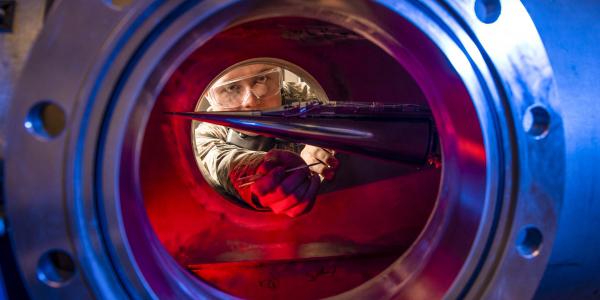 An Air Force Academy cadet peers into a wind tunnel used for measuring effects on hypersonic research vehicles. Development of new hypersonic craft is speeding up, but considerable research remains to overcome some technological challenges.  U.S. Air Force photo