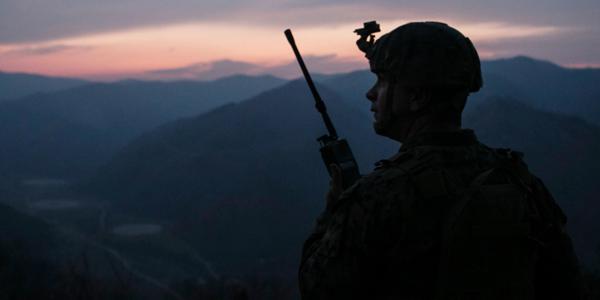 A U.S. Marine staff sergeant radios pilots during an exercise in South Korea. Marine Expeditionary Forces (MEFs) often must tap assets of other services when deployed—a situation the Corps is trying to eliminate.