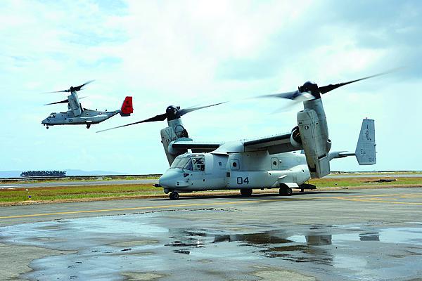 A U.S. Marine Corps MV-22 Osprey prepares for takeoff as another lifts off during Operation Damayan in Tacloban, Philippines. The cell phone infrastructure in Tacloban, the worst-hit area in the Philippines, still functioned after the storm. This allowed connectivity among military and nongovernmental organizations for coordinating relief efforts in that region.