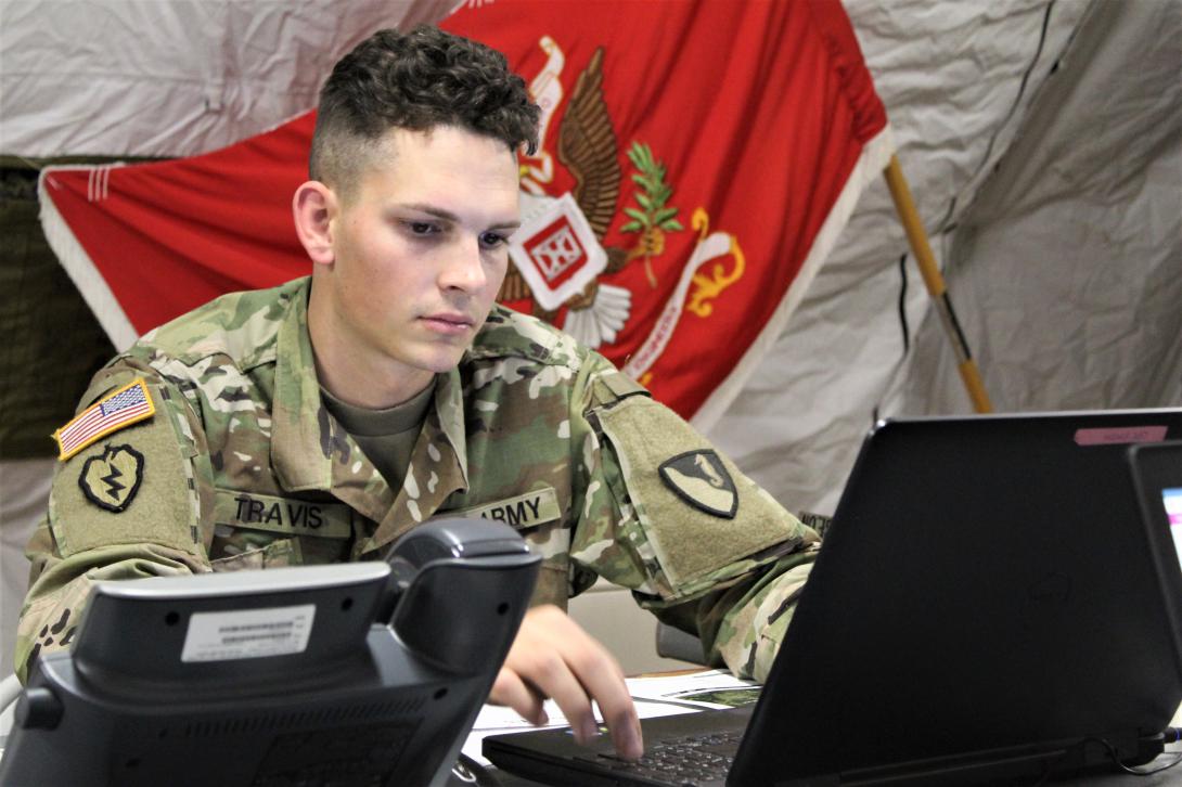 A U.S. Army sergeant installs a network multifunction device on a tactical operations center computer during a civil support exercise. The Army’s effort to unify its network environment aims at modernizing hardware and software across the breadth of field, base and post facilities.  U.S. Army