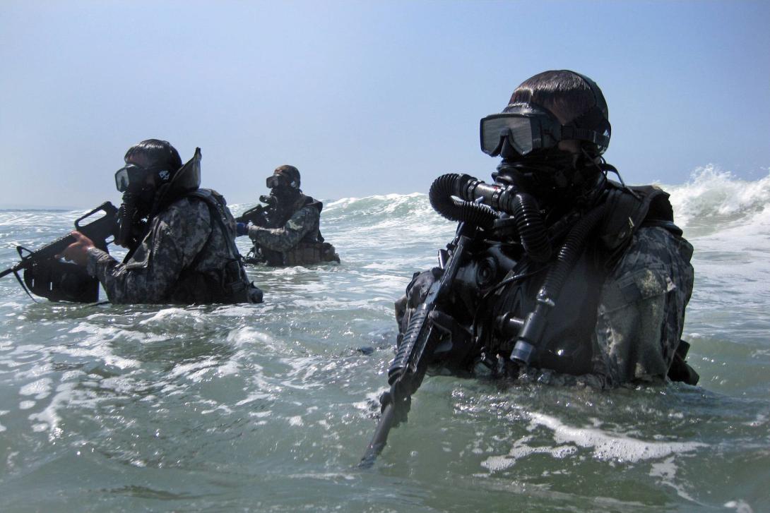 A group of special operations forces (SOF) divers trains in seaborne infiltration techniques. As adversaries become more sophisticated, SOF operations must rely more on flexible and resilient networking capabilities.