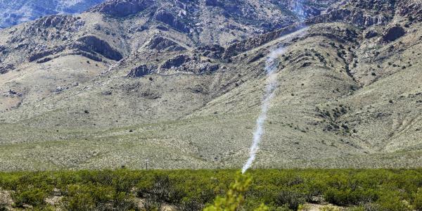 Smoke rises from an unmanned aerial vehicle after it was engaged by a counter system in March during the Hard Kill Challenge in New Mexico. Sponsored by the Defense Threat Reduction Agency (DTRA) and the Joint Improvised-Threat Defeat Organization (JIDO), the challenge focused on stopping the growing threat posed by unmanned aerial systems. Photo by 1st Lt. Chelsi Spence, USAF, DTRA