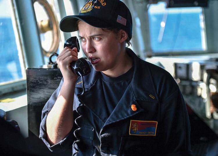 A U.S. Navy ensign uses a bridge-to-bridge radio to speak with a patrol craft crew in the Philippine Sea. With radio spectrum demands limiting Navy communications, light-based systems may emerge for internal and local communication needs. Credit: U.S. Navy photography by Mass Communications Spec. 1st Class Benjamin Dobbs, USN