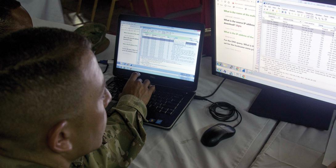 Servicemen participate in a cyber warrior exercise overseas. The U.S. Army’s program executive officer for enterprise information systems (PEO EIS) is striving to speed new software into cyber systems while maintaining effective operations. U.S. Army Reserve photo