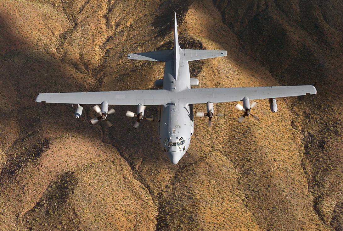 A U.S. Air Force EC-130H Compass Call electronic warfare aircraft flies over the Arizona desert during a training mission. The 24th Air Force used a Compass Call in an exercise last year to test offensive cyber operations against wireless networks.