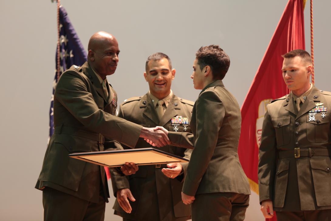 A Marine Corps lieutenant in the MCCES basic communications officer course accepts recognition for being on the Commanding General’s Honor Roll during a class graduation ceremony in April. The presence of the MCCES at Twentynine Palms has allowed Marines taking its courses to learn in the context of a Marine Corps deployment environment.