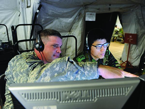 U.S. Army and Republic of Korea personnel work together during Ulchi Freedom Guardian exercises. Both countries are collaborating to a greater degree in non-conflict environments to improve their interoperability should hostilities break out.