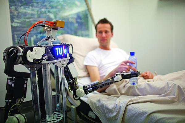 Researchers working on the RoboEarth project demonstrate a robot’s ability to learn and cooperate with other robotic systems to serve medical patients. The project uses cloud computing to teach robots to perform tasks that seem intuitive for humans but are a challenge for robots.