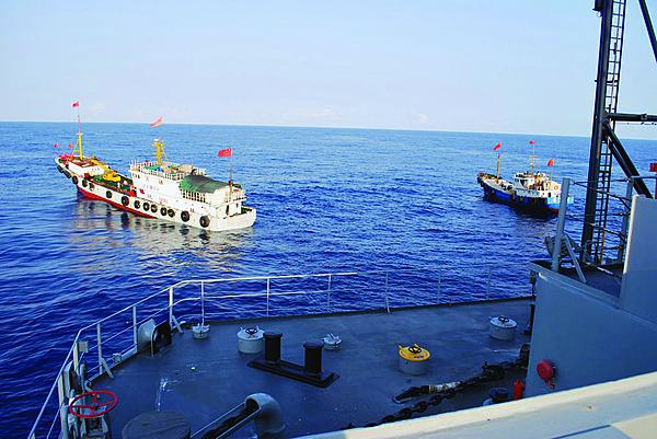 Two Chinese trawlers stop directly in the path of a U.S. Navy ocean surveillance ship in international waters in the South China Sea, forcing the ship to conduct an emergency all-stop to avoid a collision. China employs a broad spectrum of vessels ranging from “civilian” fishing boats to armed navy warships to enforce its claims to multiple territories in and around the South China Sea.