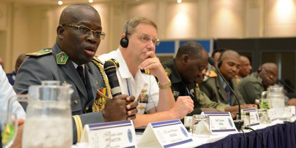 Col. Leon-Rodance Ndinga from the Republic of Congo comments during a tabletop exercise at AE 2015 in Botswana. AE is an annual 10-day communications seminar designed to increase interoperability between partner nations to support United Nations and African Union peacekeeping, disaster response and humanitarian assistance missions.