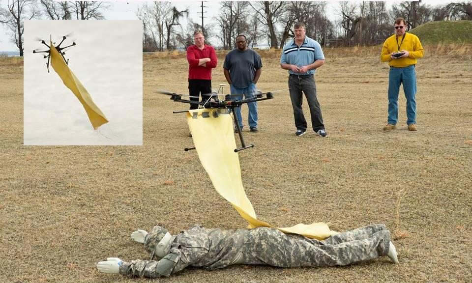 Scientists from the U.S. Army Research Laboratory test an unmanned system to deliver a blanket to a wounded soldier, part of a developing concept to use unmanned assets as protective platforms.