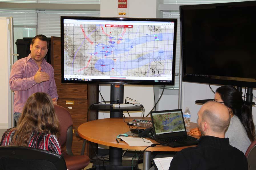  Steve Mazza, a project leader in the Army’s Communications-Electronics Research, Development and Engineering Center’s Mission Command Capabilities Division, demonstrates the Automated Planning Framework prototype, which adds artificial intelligence to automate the military decision-making process for commanders and staff. U.S. Army photo/Dan Baldwin, CERDEC
