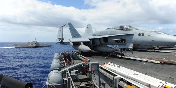 The LCS USS Independence conducts maneuvers with the aircraft carrier USS Ronald Reagan (CVN 76) during Rim of the Pacific 2014. 