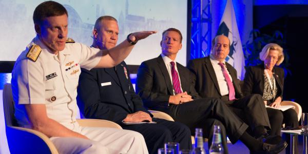 Adm. Michael Rogers, USN, commander of U.S. Cyber Command and director of the National Security Agency (l), talks about NATO’s enduring quest for cyber solutions and effective means of deterring attacks during a panel discussion at NITEC 2016 cyber conference held in Tallinn, Estonia, in June. 