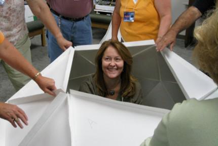 Ongoing professional development is an avenue to increasing an educator's own content knowledge and teaching strategies, says Christine Royce, who finds herself in the middle of a geodesic dome as part of a NASA Ambassadors training program.