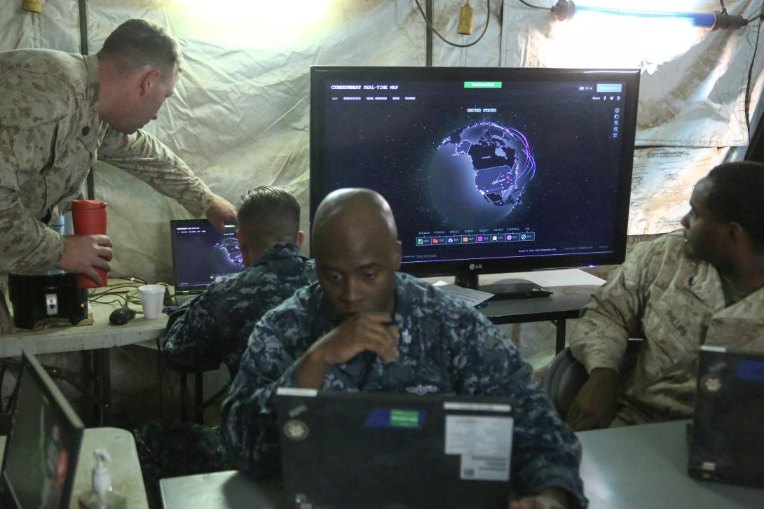 U.S. sailors and Marines monitor network activity during a large-scale exercise in August at Marine Corps Air Station Miramar, California. The purpose of the exercise was to practice deploying a fighting force of more than 50,000 military personnel to a partner nation and incorporate both live-fire and simulated combat scenarios against a near-peer enemy force.